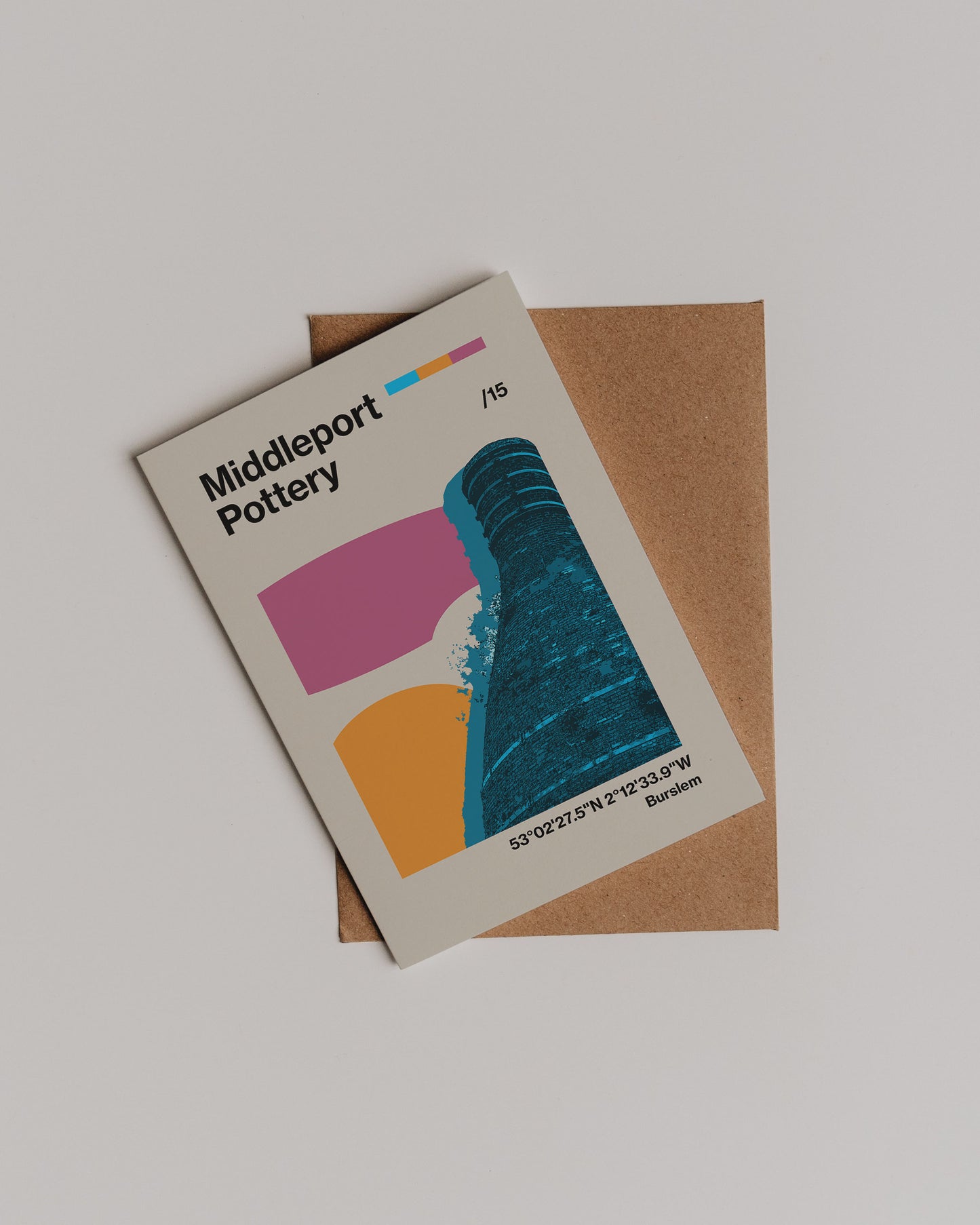 The Middleport Pottery Greetings Card highlights British craftsmanship with an abstract bottle kiln, geographic coordinates, and an envelope beneath, all set on a clean white background.