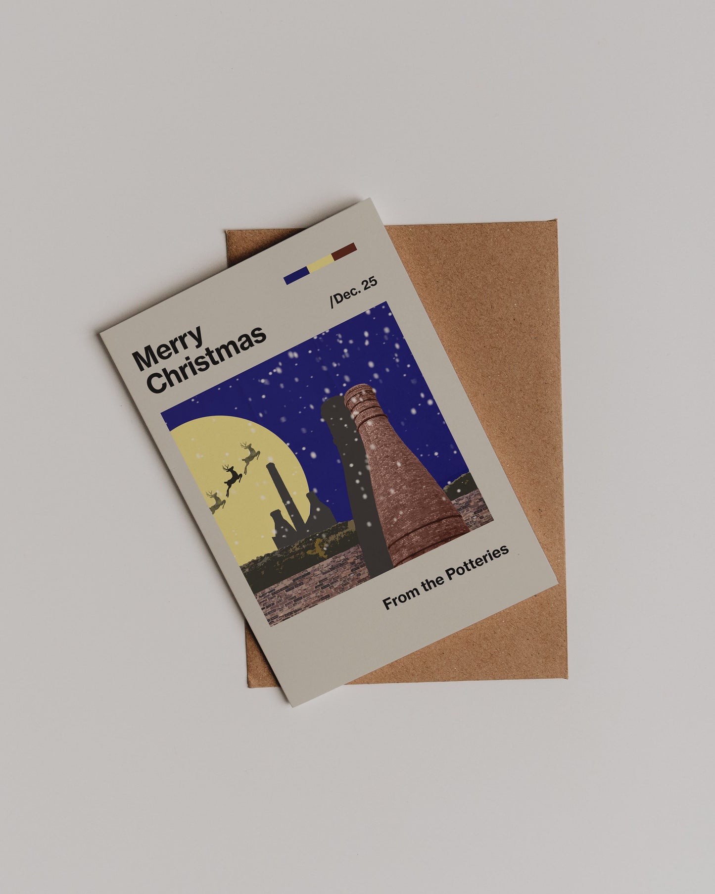 The Merry Christmas Potteries Greetings Card features a Stoke-on-Trent night scene with pottery kilns, snowfall, Santas sleigh and a yellow moon. Printed on eco-friendly cardstock, it reads Merry Christmas, Dec. 25, From the Potteries.